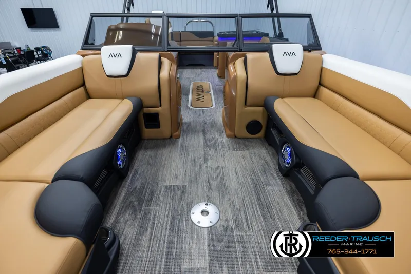 Slide: The Image of 2025 Avalon LSZ EL boat interior with tan seating and modern design. - 13