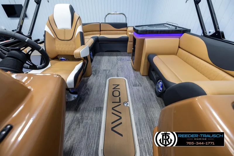 Slide: The Image of Luxurious 2025 Avalon LSZ EL boat interior with tan seating and modern design. - 14
