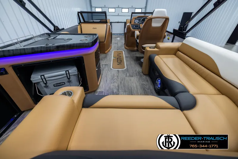 Slide: The Image of 2025 Avalon LSZ EL boat interior with luxurious seating and modern dashboard. - 16
