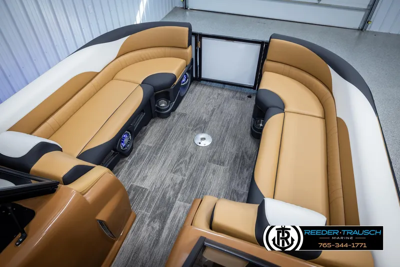 Slide: The Image of 2025 Avalon LSZ EL boat interior with tan and black seating, wood-style flooring. - 19