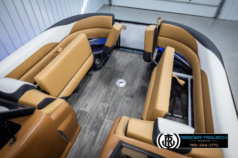 Slide: The Image of 2025 Avalon LSZ EL boat interior with tan seating and wood-style flooring. - 20