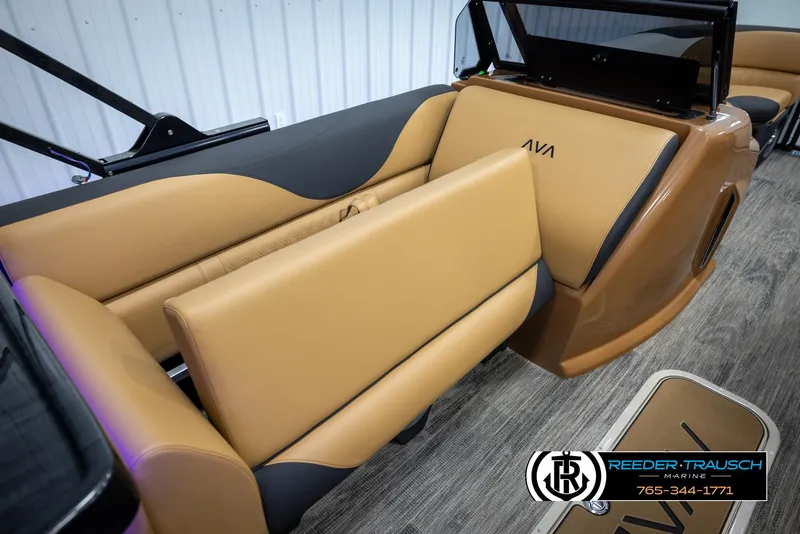Slide: The Image of 2025 Avalon LSZ EL boat interior with tan and black seating, Reeder-Trausch Marine logo. - 23