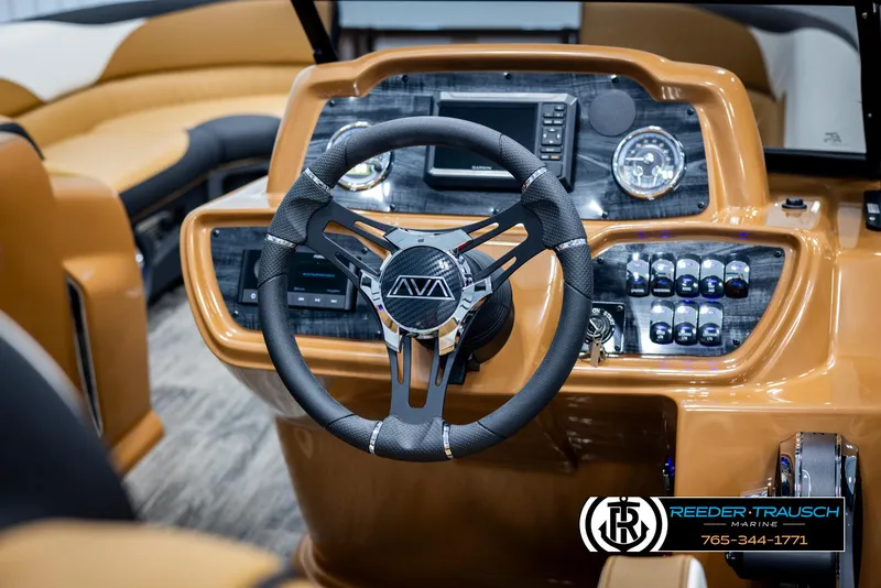 Slide: The Image of 2025 Avalon LSZ EL boat dashboard with modern steering wheel and controls. - 27