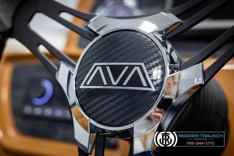 Slide: The Image of 2025 Avalon LSZ EL steering wheel with carbon fiber detail and logo. - 29