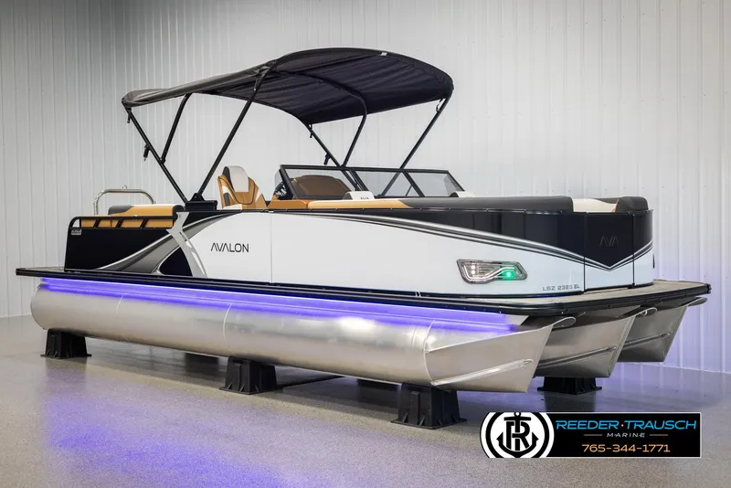 Slide: The Image of 2025 Avalon LSZ EL pontoon boat with canopy and LED lights in showroom. - 3