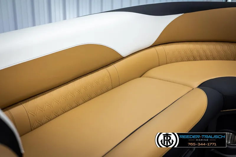 Slide: The Image of 2025 Avalon LSZ EL boat interior with tan and white leather seating. - 37