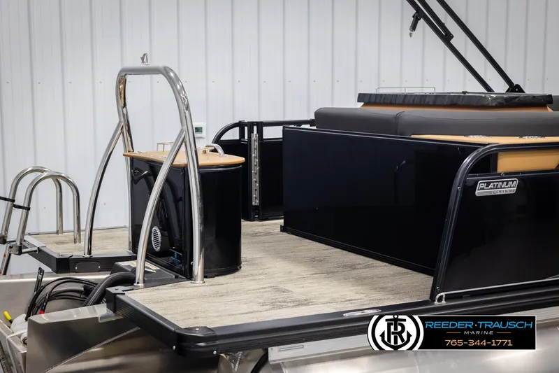 Slide: The Image of 2025 Avalon LSZ EL pontoon boat with sleek black design and modern features. - 49