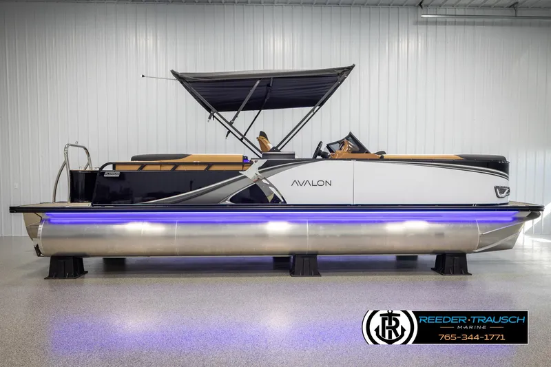 Slide: The Image of 2025 Avalon LSZ EL pontoon boat with canopy and blue underglow lighting. - 5