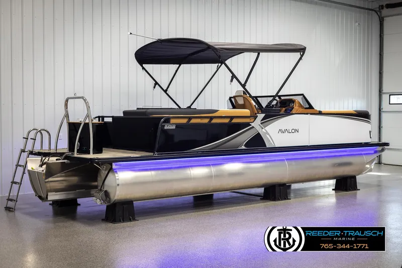 Slide: The Image of 2025 Avalon LSZ EL pontoon boat with canopy in showroom. - 6