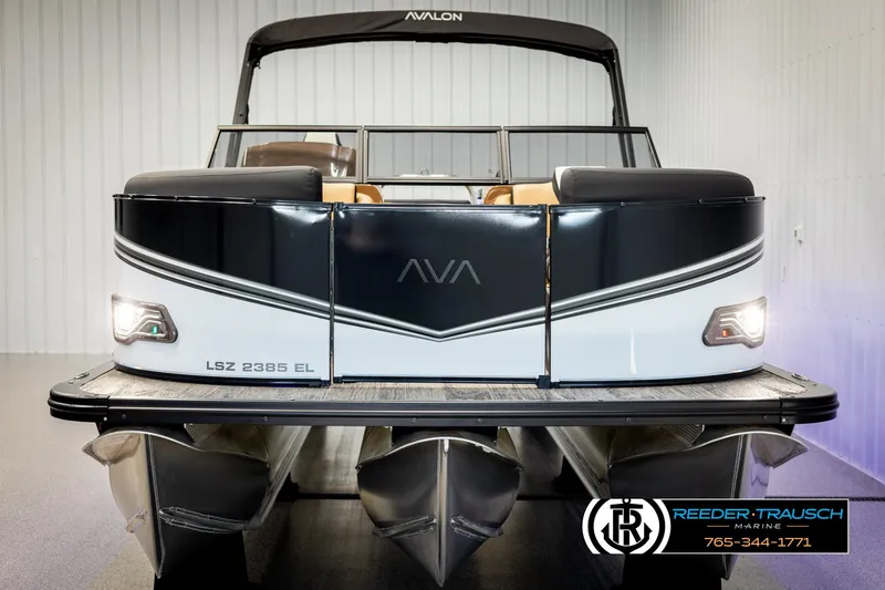 Slide: The Image of 2025 Avalon LSZ EL pontoon boat, sleek design, front view in showroom. - 8