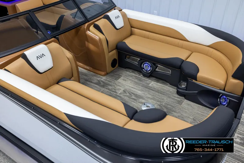 Slide: The Image of 2025 Avalon LSZ EL boat interior with tan and black seating, Reeder-Trausch Marine logo. - 9