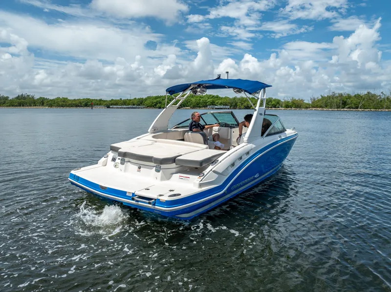 Slide: The Image of 2017 Chaparral 227 SSX boat cruising on a sunny day with blue skies. - 11
