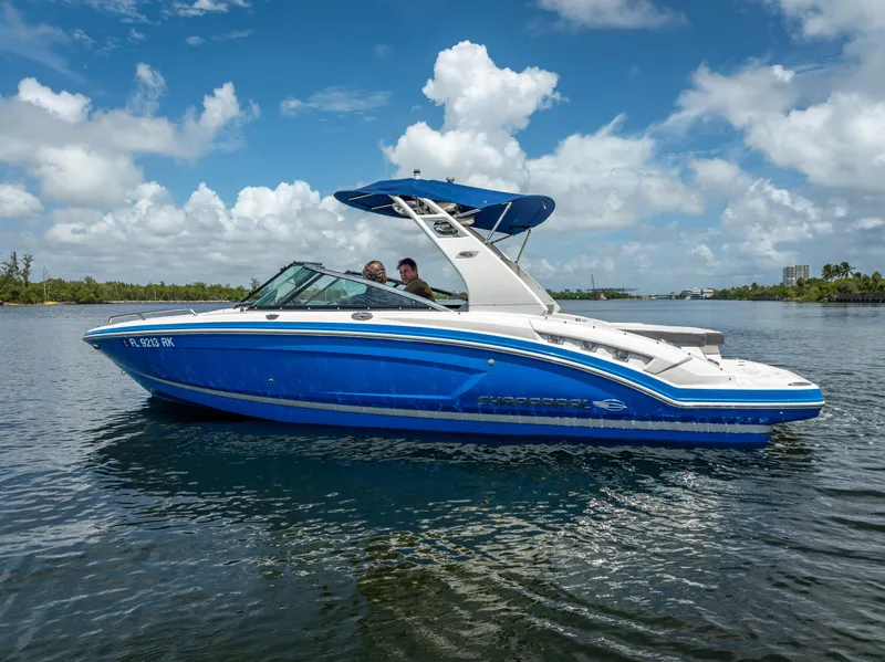 Slide: The Image of 2017 Chaparral 227 SSX boat on water under blue sky. - 14