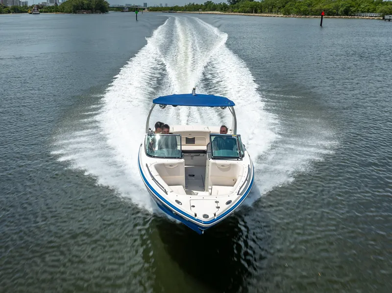 Slide: The Image of 2017 Chaparral 227 SSX boat cruising on a calm waterway. - 16