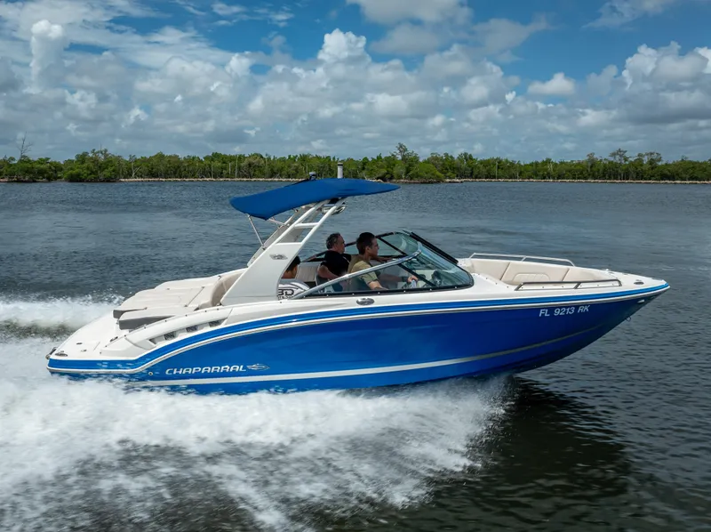 Slide: The Image of 2017 Chaparral 227 SSX boat cruising on a sunny day with blue skies. - 24