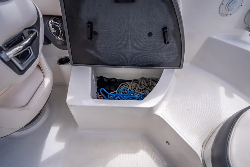 Slide: The Image of Open storage compartment in 2017 Chaparral 227 SSX boat with ropes and accessories. - 30