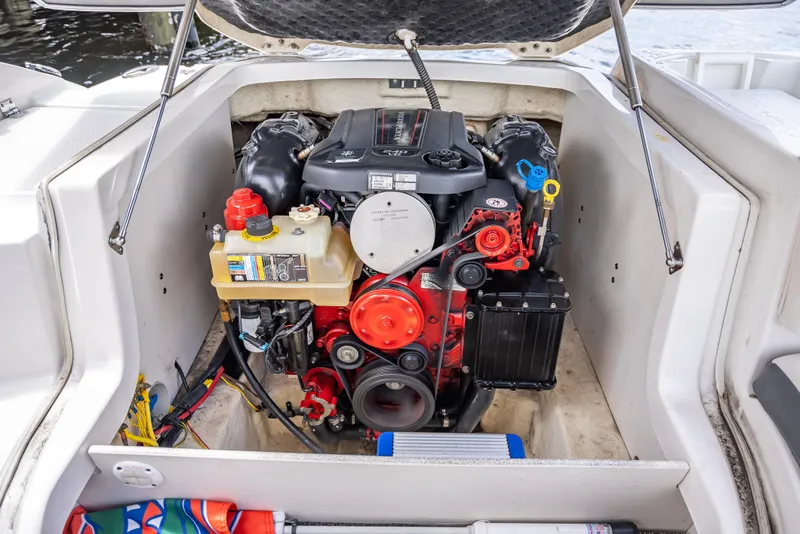 Slide: The Image of Engine compartment of a 2017 Chaparral 227 SSX boat, showcasing detailed components. - 35