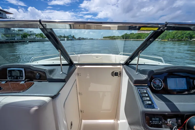 Slide: The Image of 2017 Chaparral 227 SSX boat interior with dashboard and water view. - 38
