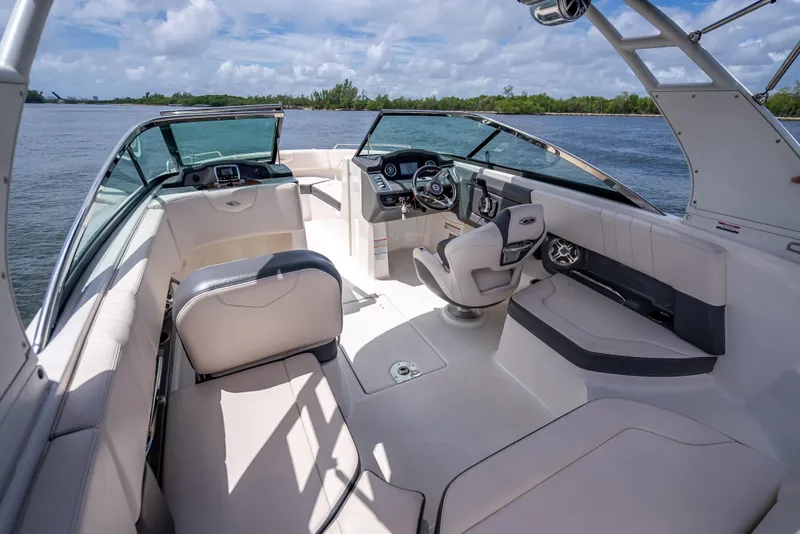 Slide: The Image of 2017 Chaparral 227 SSX boat interior with luxurious seating and modern dashboard. - 40