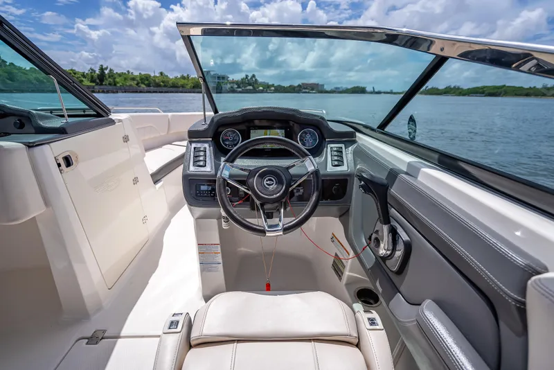 Slide: The Image of Interior view of 2017 Chaparral 227 SSX boat cockpit with steering wheel and dashboard. - 48