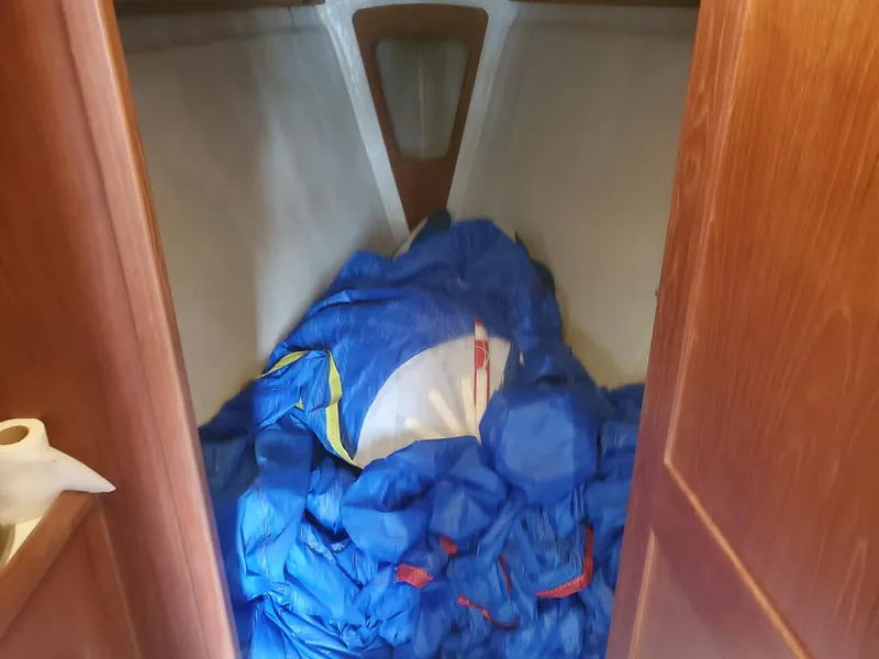 Slide: The Image of Interior cabin of a 2001 Schock 35 sailboat with wooden furnishings. - 12