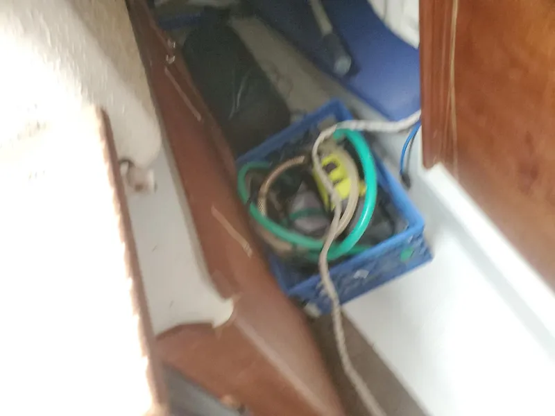 Slide: The Image of Storage area inside a 2001 Schock 35 boat with cables and equipment. - 21