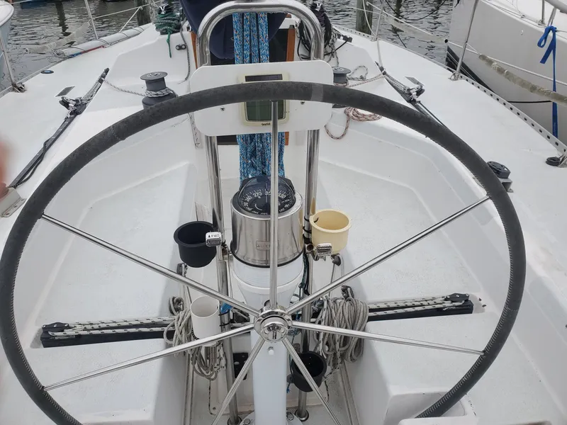Slide: The Image of Steering wheel and navigation equipment on a 2001 Schock 35 sailboat. - 6