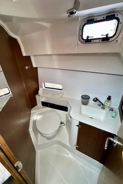 Slide: The Image of 2024 Beneteau Antares 9 bathroom with modern fixtures and compact design. - 12