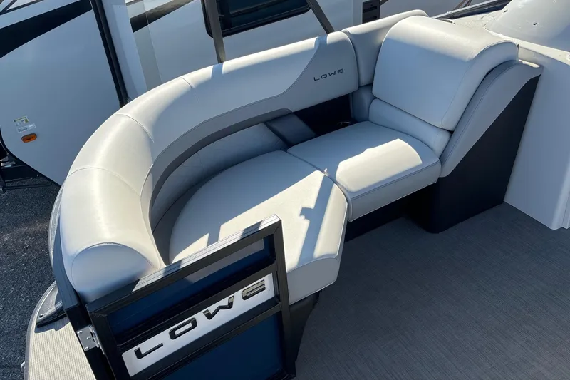Slide: The Image of 2025 Lowe SS210DHCL boat seating with modern gray upholstery and sleek design. - 5