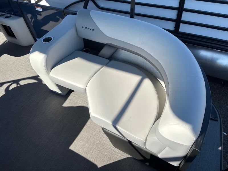 Slide: The Image of 2025 Lowe SS210DHCL boat seat with gray upholstery and cup holder. - 6