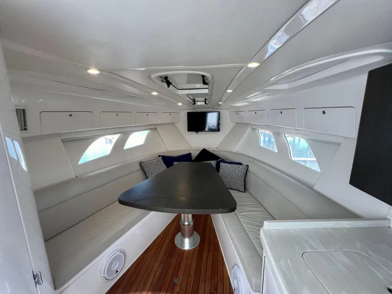 Slide: The Image of 2018 Intrepid 407 Cuddy interior with sleek seating and modern design. - 12