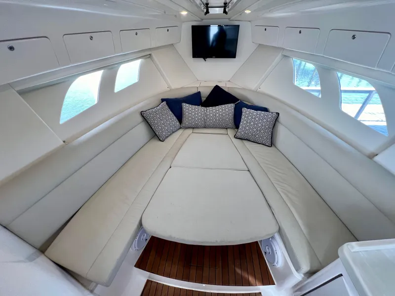Slide: The Image of Luxurious 2018 Intrepid 407 Cuddy cabin with plush seating and stylish cushions. - 13