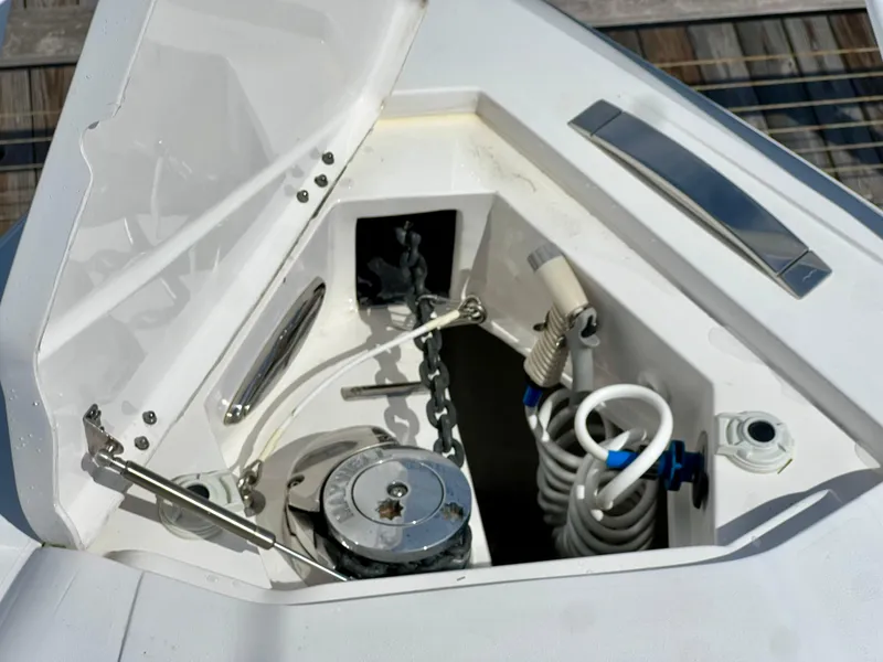 Slide: The Image of Anchor compartment of 2018 Intrepid 407 Cuddy boat with chain and hose. - 20