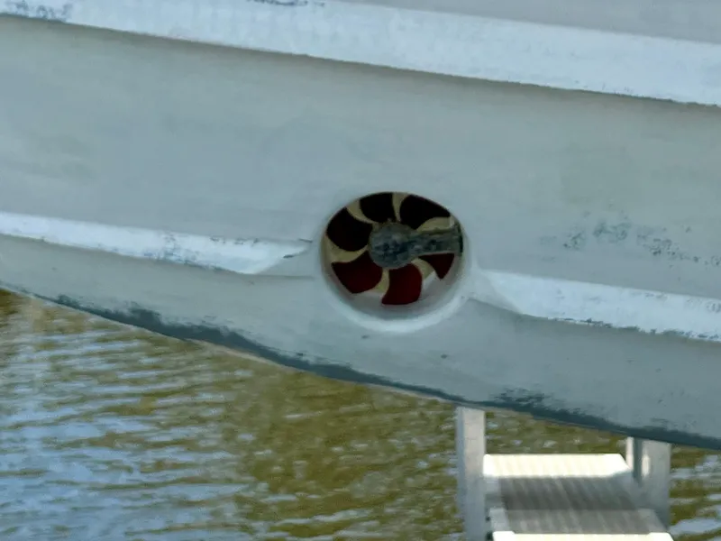 Slide: The Image of Close-up of 2018 Intrepid 407 Cuddy bow thruster in water. - 23