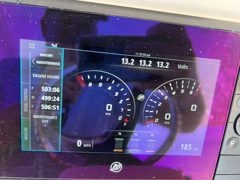 Slide: The Image of Dashboard of a 2018 Intrepid 407 Cuddy showing engine hours and voltage. - 27