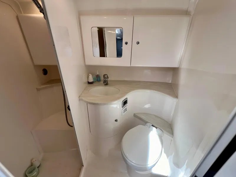 Slide: The Image of Luxurious bathroom in 2018 Intrepid 407 Cuddy boat, featuring modern fixtures and ample storage. - 35