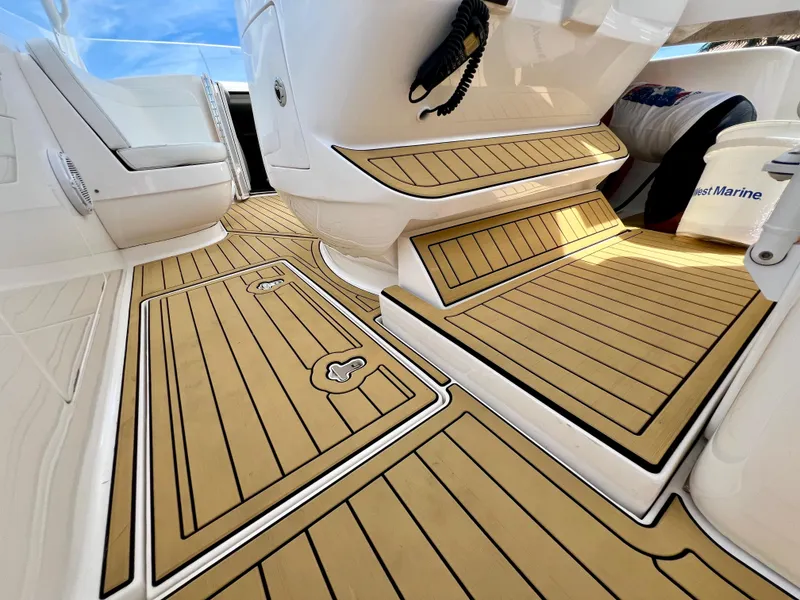 Slide: The Image of 2018 Intrepid 407 Cuddy boat interior with teak-style flooring. - 39