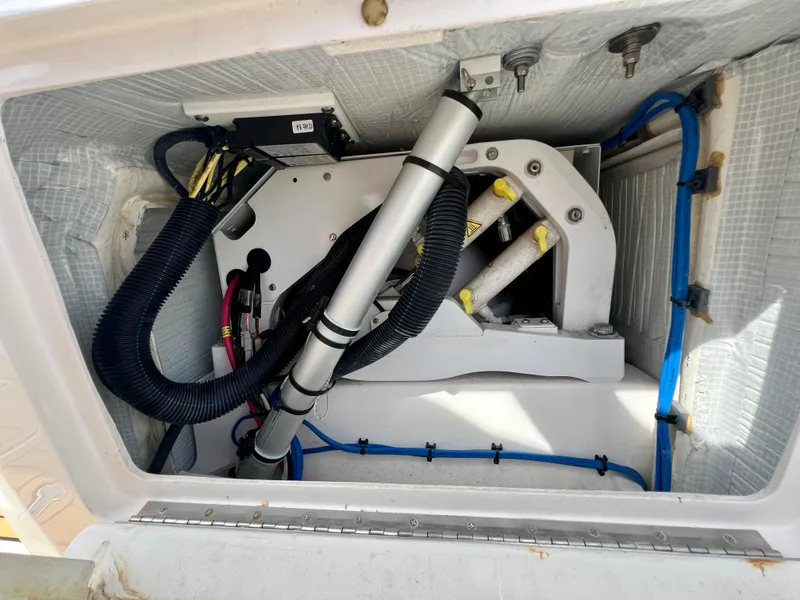 Slide: The Image of Engine compartment of 2018 Intrepid 407 Cuddy with visible wiring and components. - 43