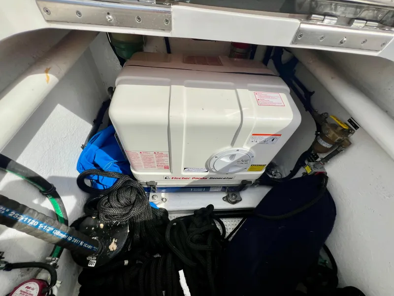 Slide: The Image of 2018 Intrepid 407 Cuddy engine compartment with generator and equipment. - 44