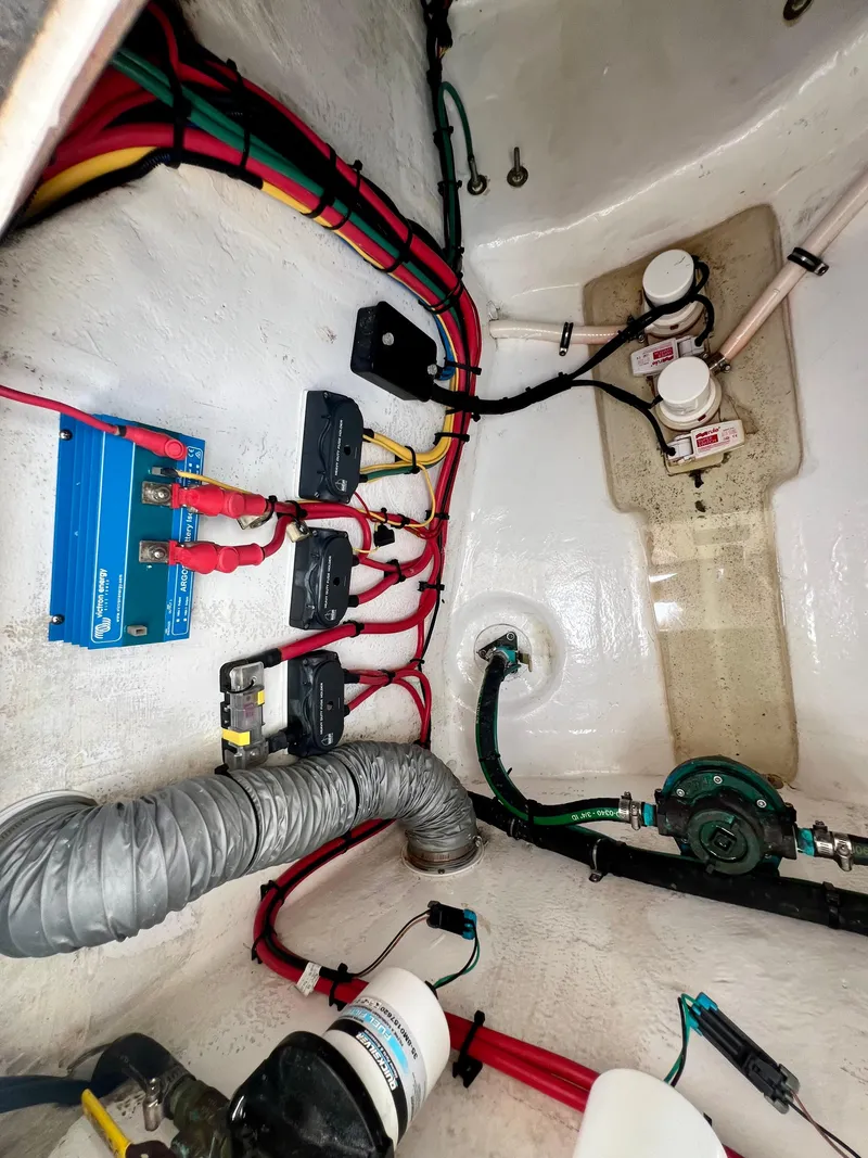 Slide: The Image of 2018 Intrepid 407 Cuddy electrical wiring and components in engine compartment. - 47