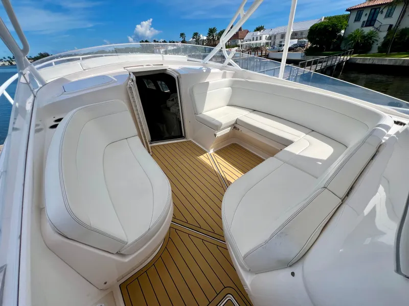 Slide: The Image of 2018 Intrepid 407 Cuddy boat with spacious seating and teak flooring. - 8