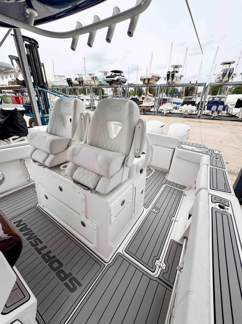Slide: The Image of 2018 Sportsman Open 312 Center Console boat interior with cushioned seating. - 12