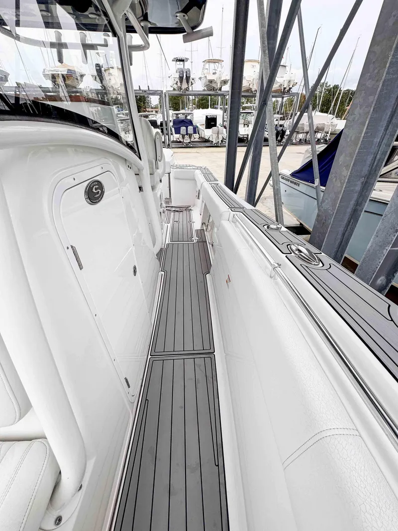 Slide: The Image of 2018 Sportsman Open 312 Center Console boat docked at marina. - 16