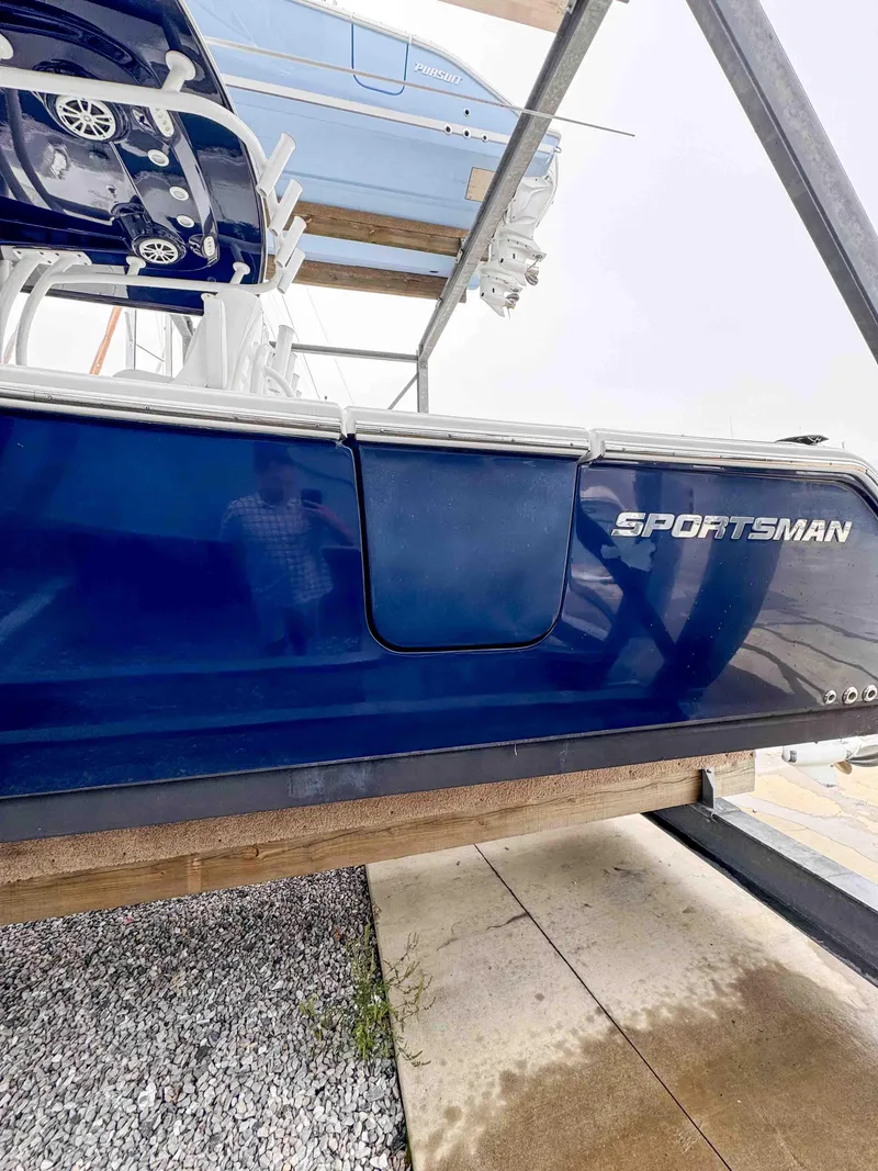 Slide: The Image of 2018 Sportsman Open 312 Center Console boat in storage. - 2