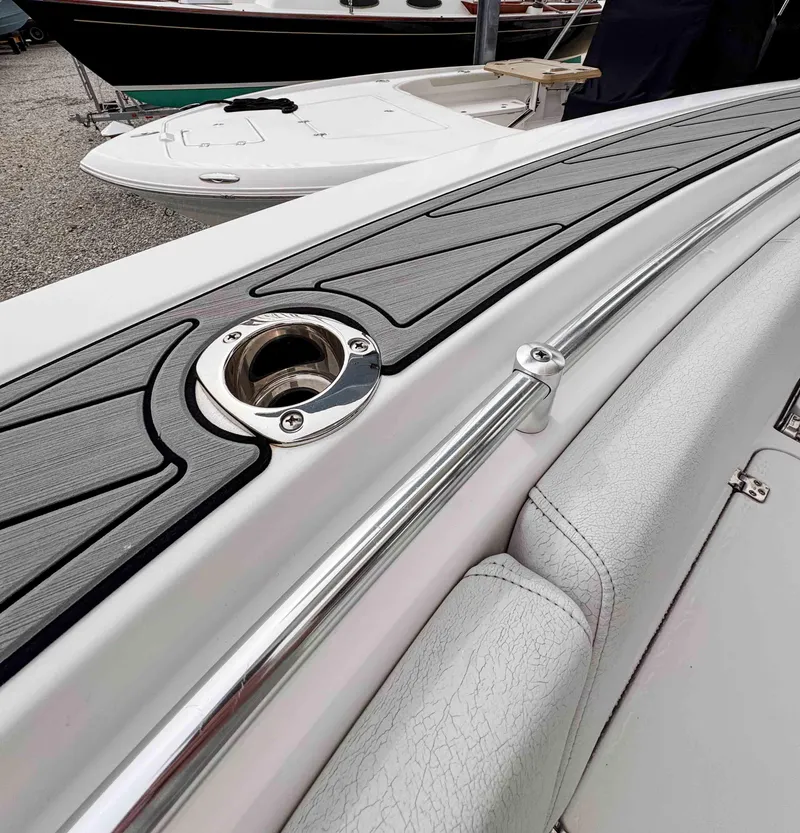 Slide: The Image of 2018 Sportsman Open 312 Center Console boat deck with sleek design and rod holder. - 23