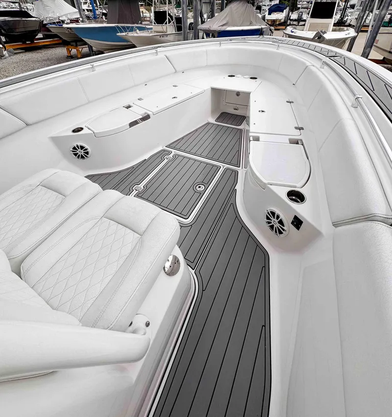 Slide: The Image of 2018 Sportsman Open 312 Center Console boat interior with sleek seating and modern design. - 24