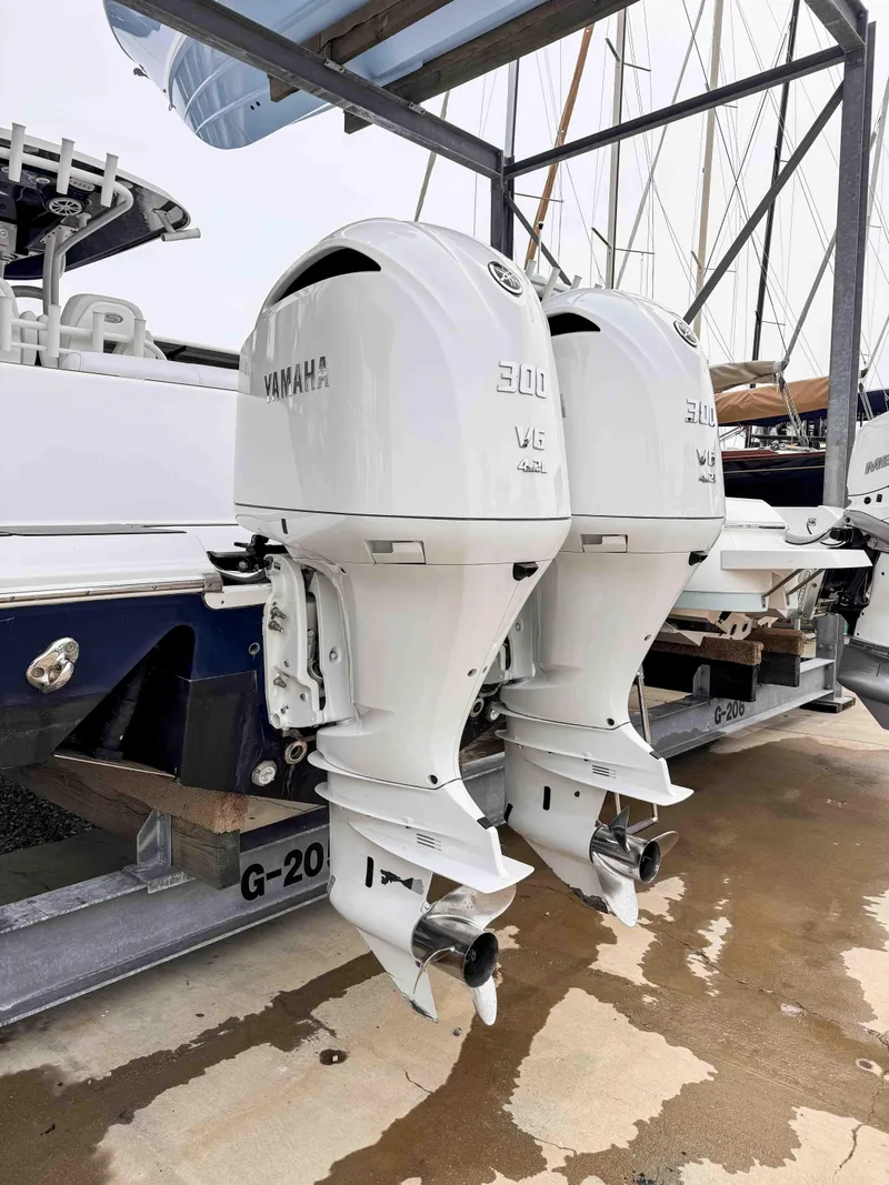 Slide: The Image of 2018 Sportsman Open 312 Center Console with twin Yamaha 300 V6 outboard engines. - 4