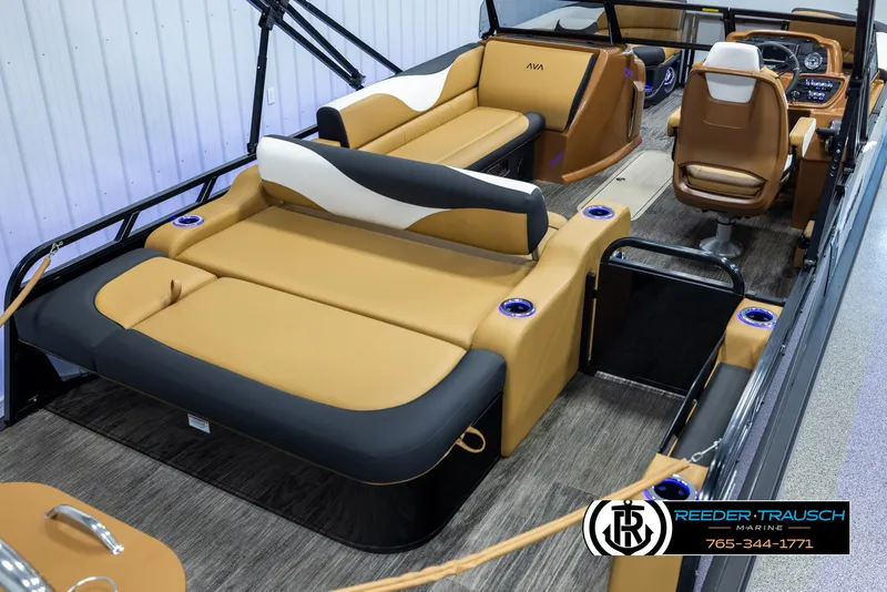 Slide: The Image of 2025 Avalon LSZ VRB boat interior with tan and black seating, modern design. - 12