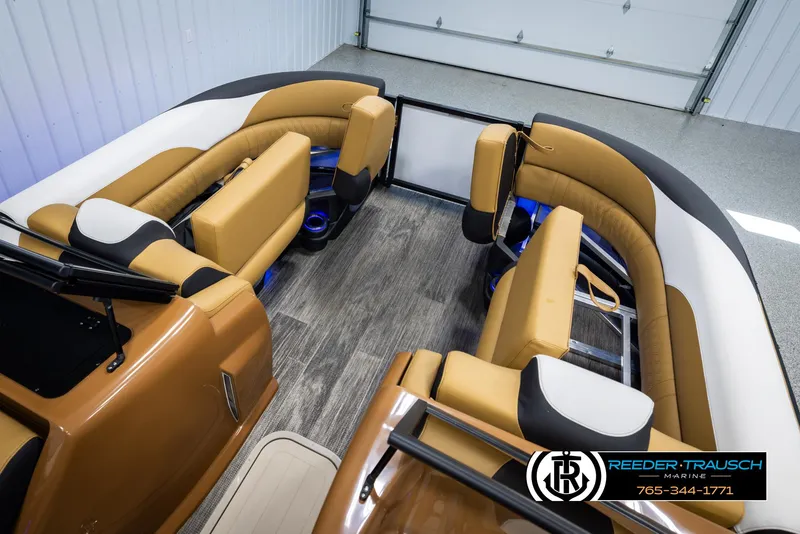 Slide: The Image of Luxurious 2025 Avalon LSZ VRB boat interior with tan seating and wood flooring. - 23