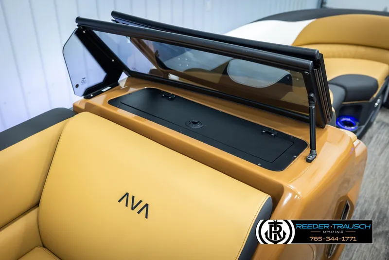 Slide: The Image of 2025 Avalon LSZ VRB boat interior with tan seating and sleek design. - 26